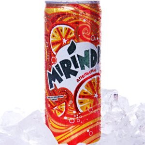 Vibrant Mirinda soda can in close-up, chilled on ice for a refreshing look.